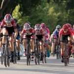 A scene of dozens of riders competing in a bike race in the Elgin Downtown Road Circuit