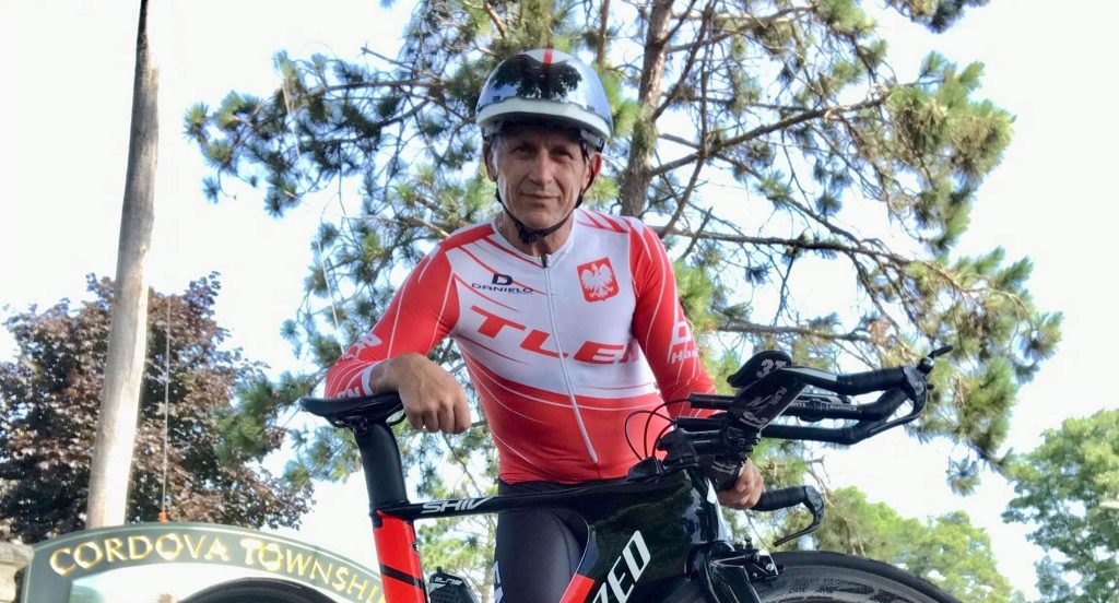 A participant poses with his bicycle at the Dr. Craig Schultz Memorial 20k-40k Time Trial in Cordova, IL