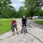 2 cyclists pose for a picture following an event at the Herscher, IL bike race.