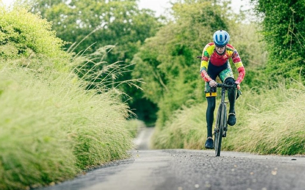 A rider competes on a gravel road at the Shaw Crank Redemption 20k Gravel Time Trial event